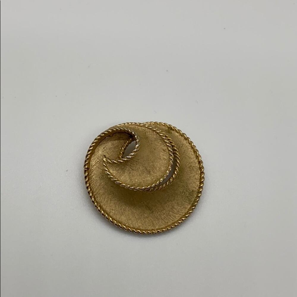 Trifari Gold swirl brooch